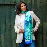woman wearing mint green and cerulean blue long silk scarf in summer branches design by Louis Jane