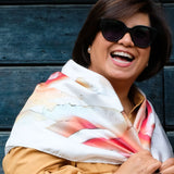 woman wearing Camelia Cream large silk square scarf over shoulders