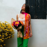 woman wearing louis jane summer branches long silk scarf in fuschia and tangerine colour